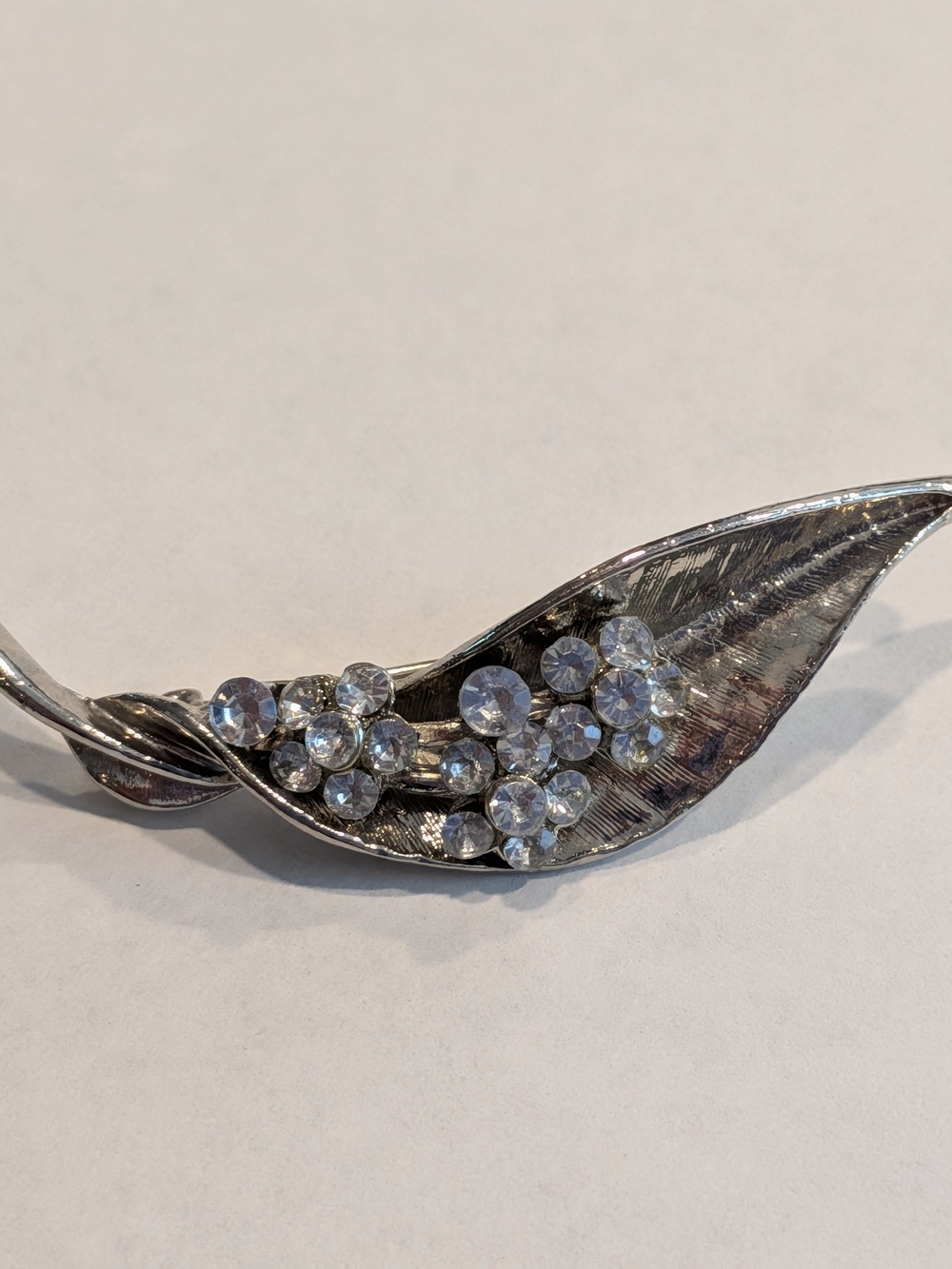 Silver-Tone Leaf Brooch with Clear Crystal Clusters
